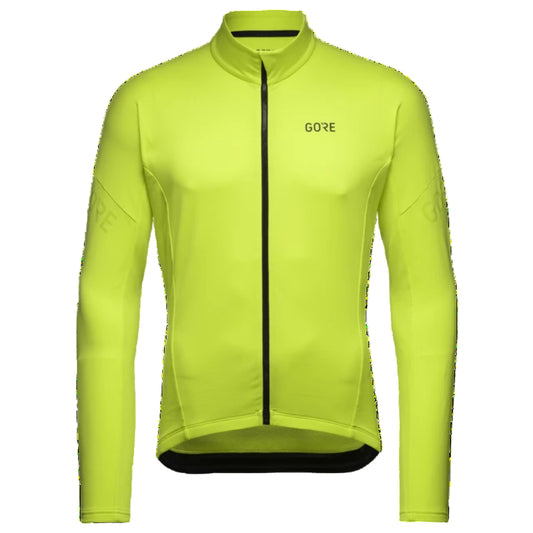 Yellow cycling jacket with 'GORE' branding on a white background