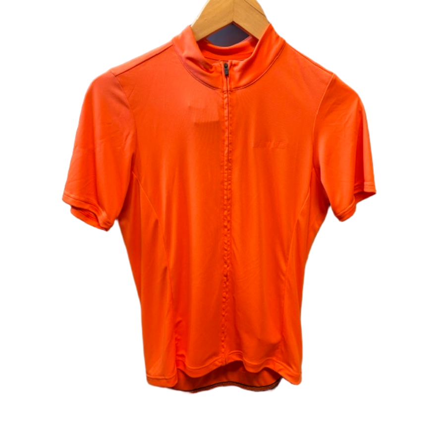 Orange short-sleeve shirt on a hanger against a gray background