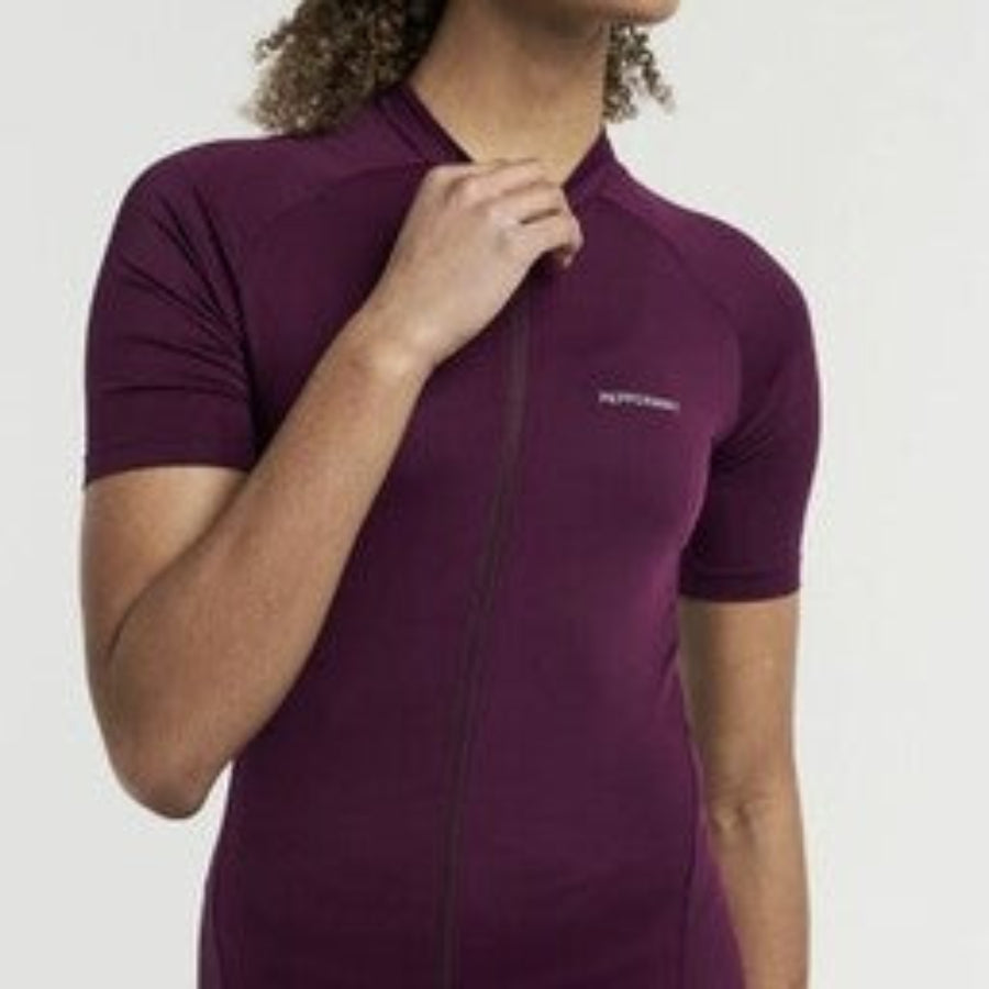 Person wearing Burgandy Peppermint Cycling Jersey with a Peppermint brand logo on a white background