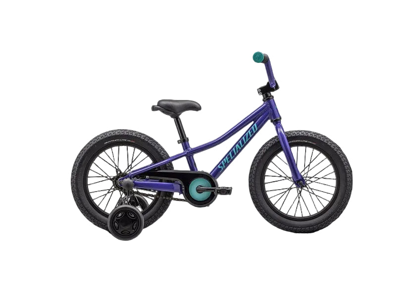 Purple children's bicycle on a black background