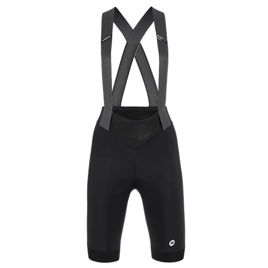 Black cycling bib shorts with suspenders on a light gray background