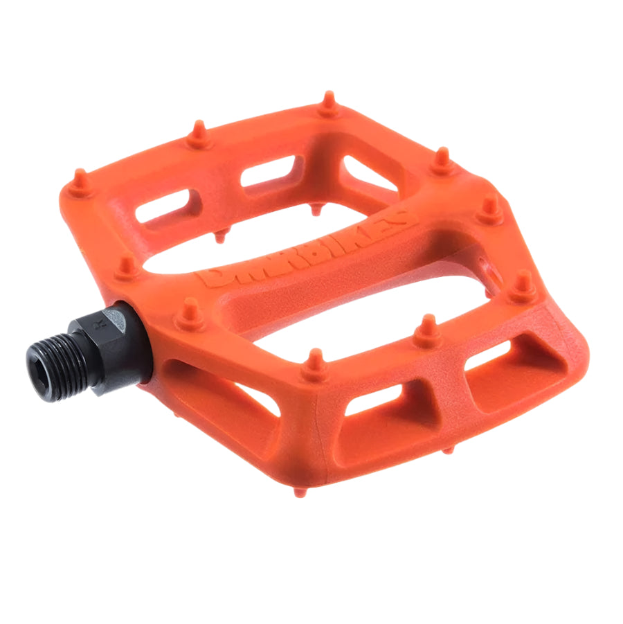 Orange DMR bicycle pedal with 'Duel' branding on a white background