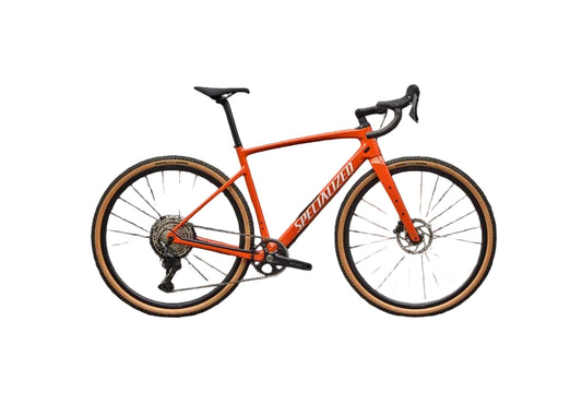 Orange bicycle with black components on a black background