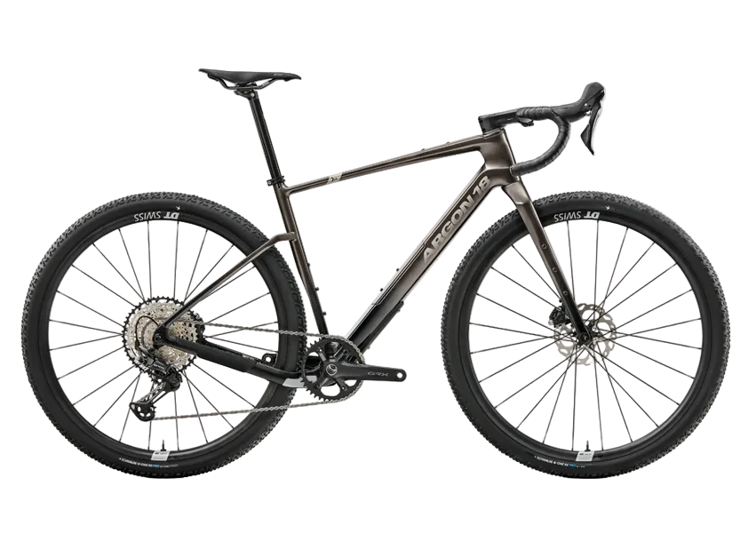 Argon 18 Dark matter GRX gravel bicycle with a dark metallic bronze frame, black components, and knobby tires, shown from a side profile on a solid white background.