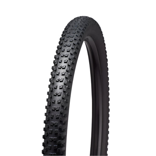 Black bicycle tire with tread pattern on a light gray background
