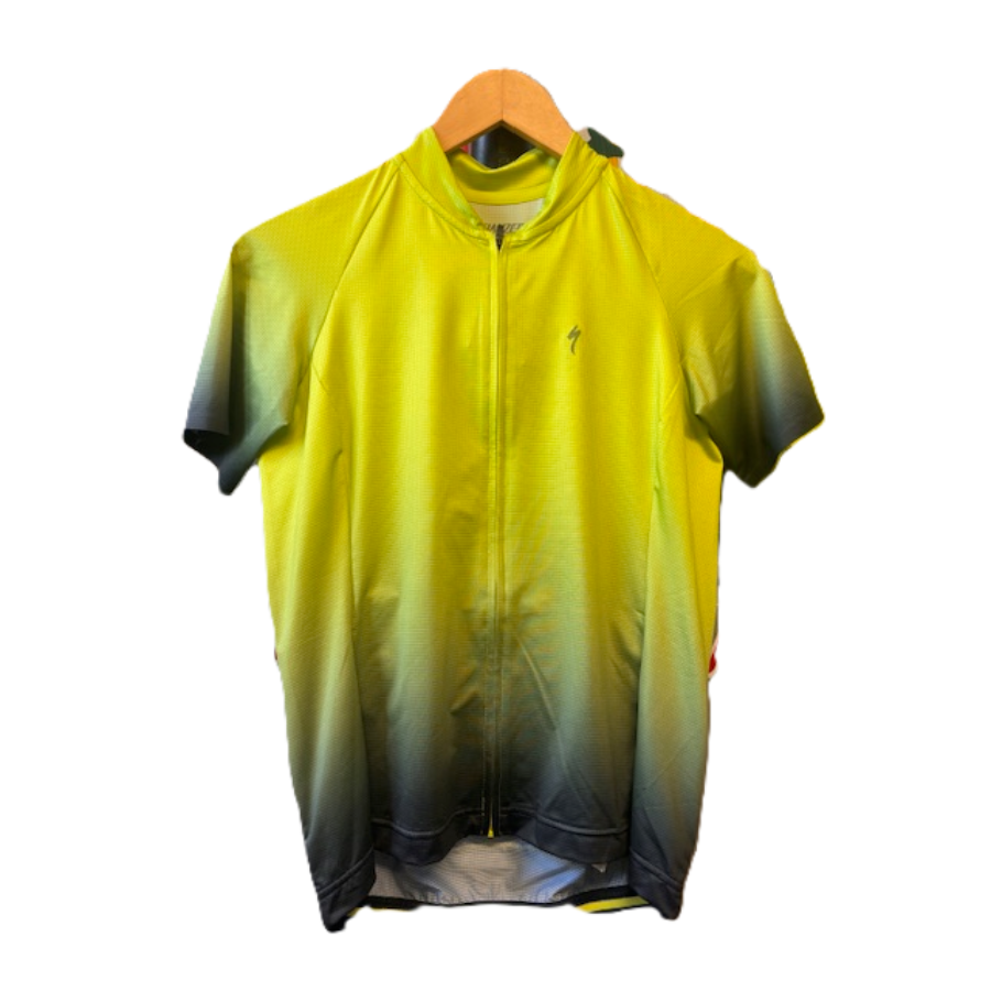 Yellow and black gradient cycling jersey on a hanger with a white background