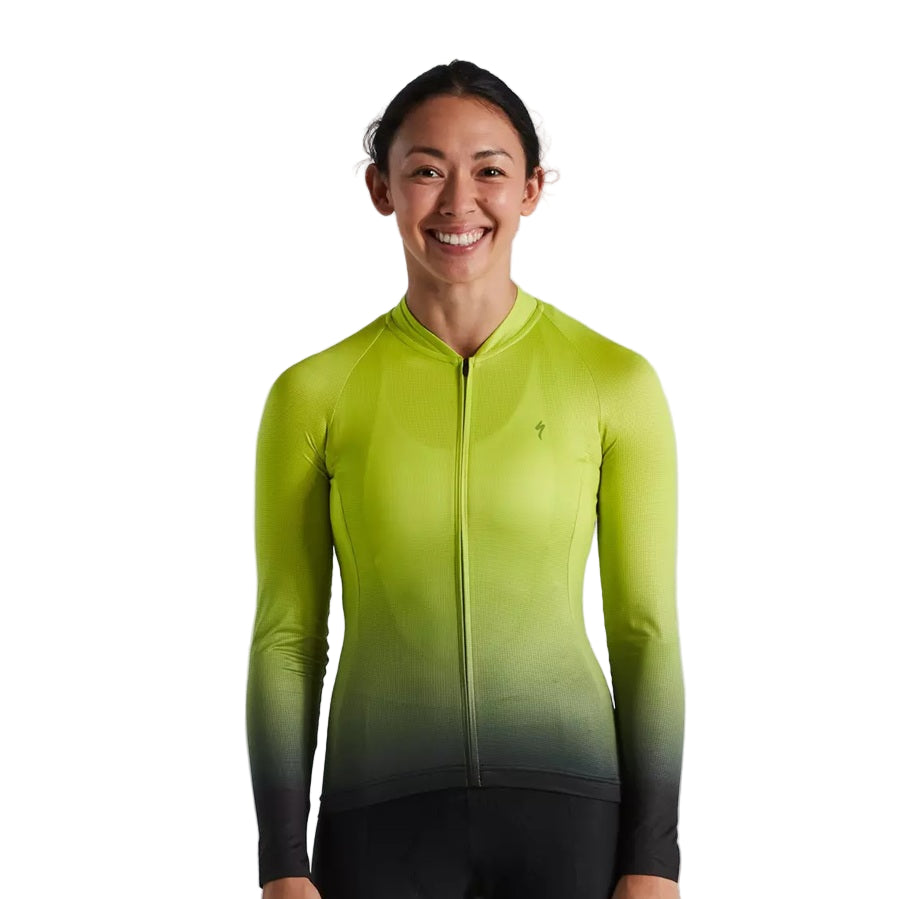Women wearing a green to black gradient Specialized hyperviz cycling jersey on a light gray background