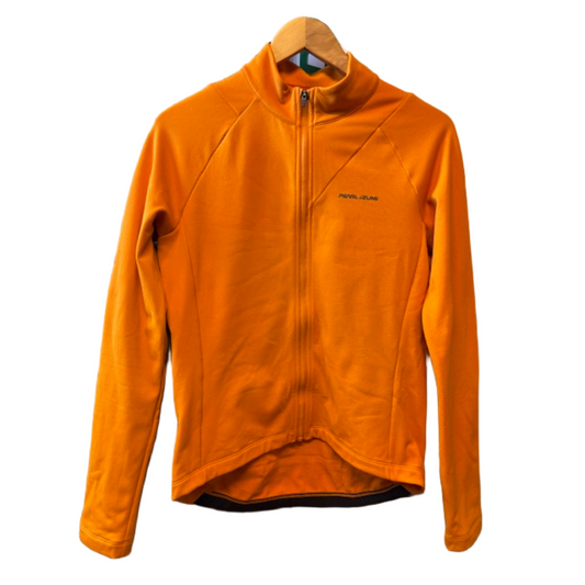Orange fleece jacket on a hanger with a colorful background
