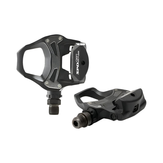 Pair of black bicycle pedals on a white background