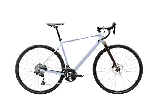 White bicycle with black components on a light gray background